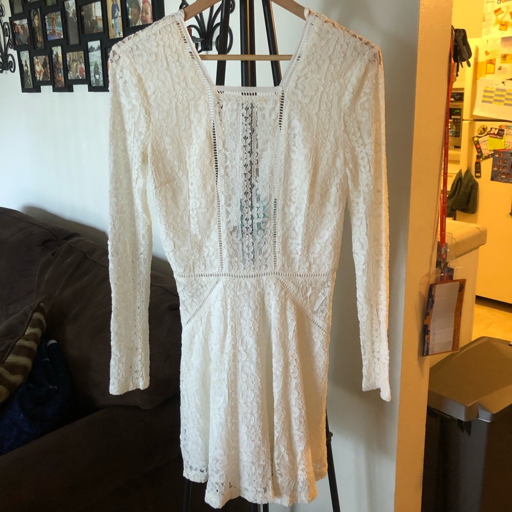 Women’s white long sleeved lacy dress